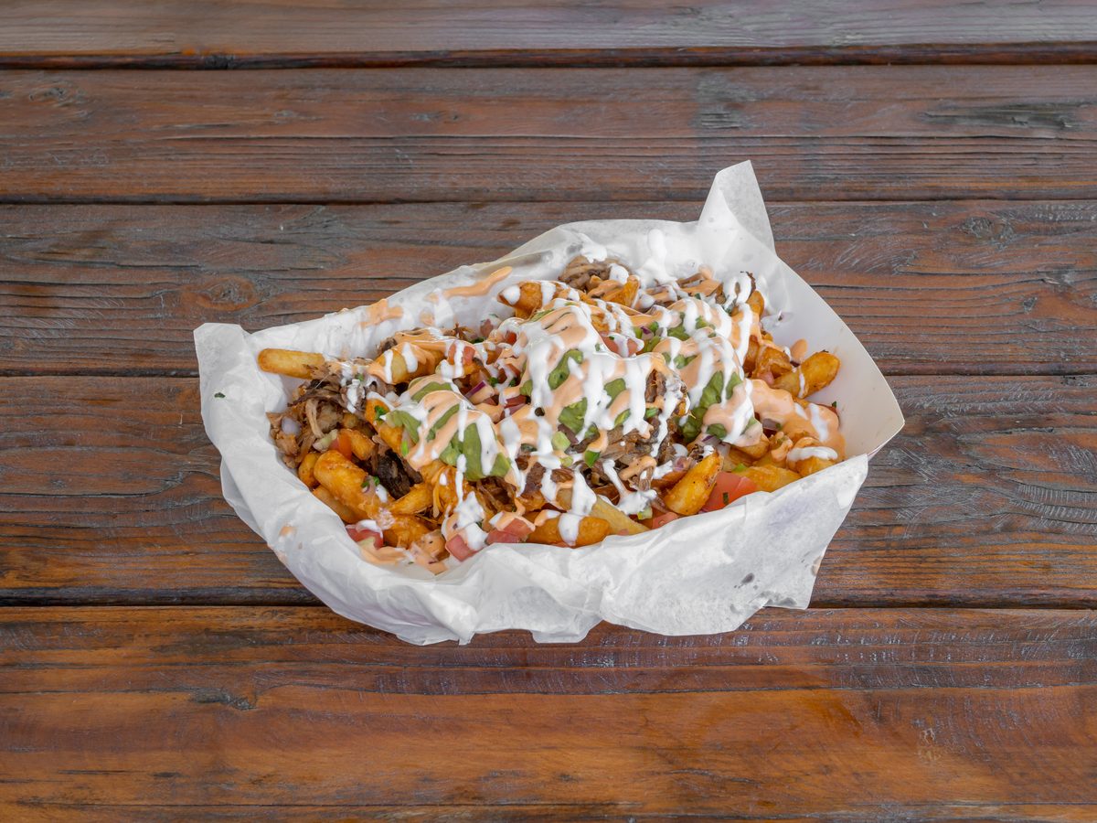 Chef's Truck loaded fries with carnitas, guacamole and chipotle aioli