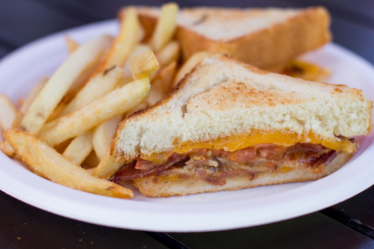 Golden grilled cheese sandwich with fries
